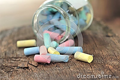 Colorful chalk placed on old wood background Stock Photo