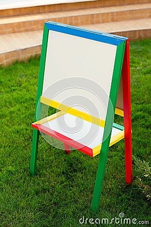 Colorful children easel with blank canvas Stock Photo