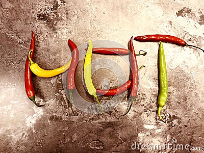 Colorful chili peppers on stone background. Stock Photo