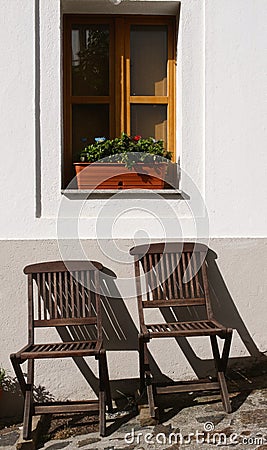 Colorful and chill chairs outside a house Stock Photo