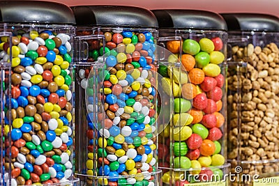 Colorful chocolate candy pills.Gumball machine filled with pills and drugs.Sweet food photo concept Stock Photo