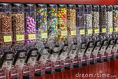 Colorful chocolate candy pills.Gumball machine filled with pills and drugs.Sweet food photo concept Stock Photo