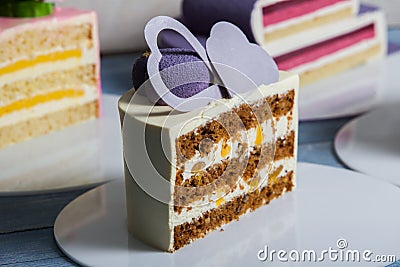 Assortment of pieces of cake on messy table, copy space. Several slices of delicious desserts Variety of tasty cakes Stock Photo