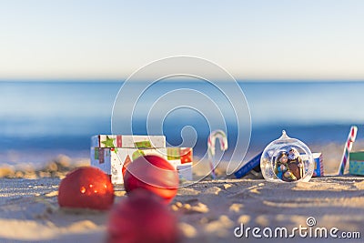 Christmas balls on the beach Stock Photo
