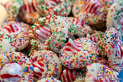 Colorful Christmas cookies made with peppermint kisses and rainbow sprinkles, selective focus Stock Photo