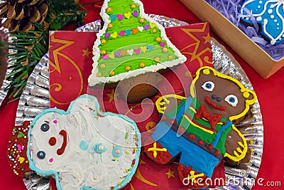 Colorful Christmas gingerbread on a red background Stock Photo