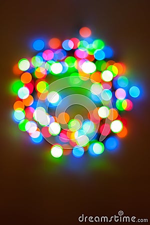 Colorful Christmas lights wreath bokeh Stock Photo