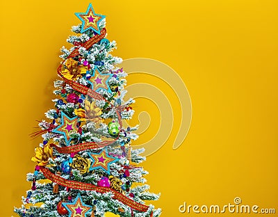 Colorful Christmas tree on yellow background Stock Photo