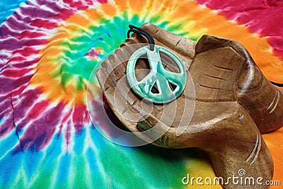 hand out peace NOT WAR.... Colorful tye dye material Stock Photo