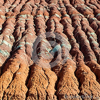 Colorful Clay Layers in Water Erosion on hill Stock Photo