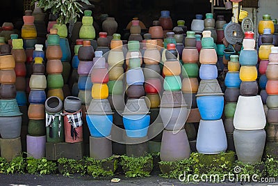 Colorful clay pots on the ground. Tourist art and craft market. Bali Island, Indonesia Stock Photo