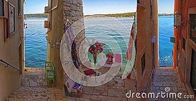 A colorful collage of streets with narrow Stairways to Sea in Rovinj Stock Photo