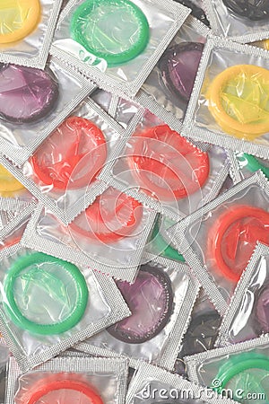 Colorful condoms background Stock Photo