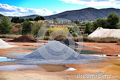 Colorful construction aggregate mountains in Alicante, Spain. Stock Photo