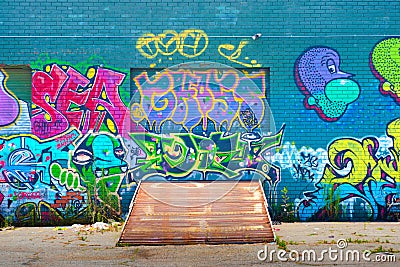Colorful contemporary graffiti on the side of a loading dock in downtown Los Angeles Editorial Stock Photo