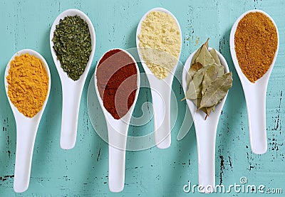 Colorful Cooking Spices On Wooden Table Stock Photo