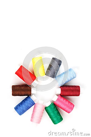 Colorful cotton craft sewing threads in flower shape isolated on white background Stock Photo