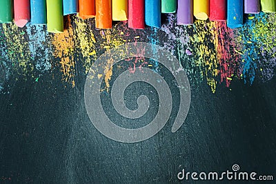 Colorful crayons on the blackboard, drawing. Back to school background. Stock Photo