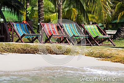 Colorful deckchairs on the beach Stock Photo