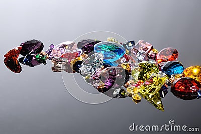 Colorful of different gemstones with space for text on gray back Stock Photo