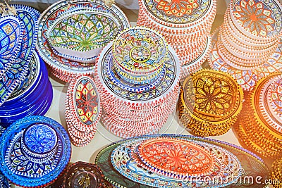 Colorful dishes and bowls with Arabic ornaments in the bazaar shop of Tunisia Editorial Stock Photo