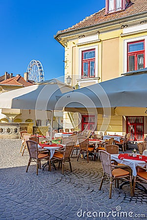 Colorful Dobo Square with restaurant tables Editorial Stock Photo