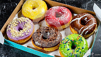 A box filled with lots of colorful donuts box for office brunch. Generative AI Stock Photo