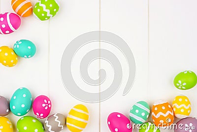 Colorful Easter Egg frame or corner border over a white wood background Stock Photo