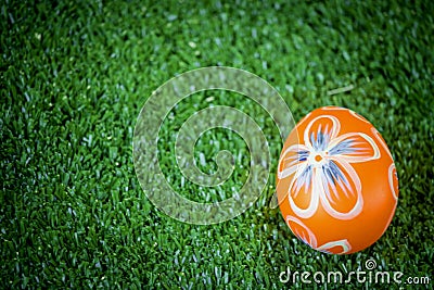 Colorful Easter egg on green grass at the yard festival and holiday spring coming Easter calibration Stock Photo