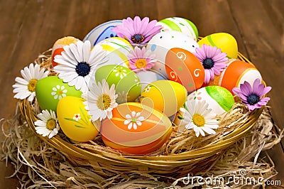 Colorful Easter eggs in a basket Stock Photo