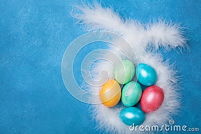 Colorful Easter eggs and bunny ears top view. Funny Easter greeting card. Copy space for text. Stock Photo