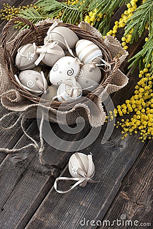 Colorful easter eggs in wicker basket Stock Photo