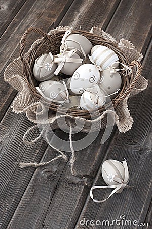 Colorful easter eggs in wicker basket Stock Photo