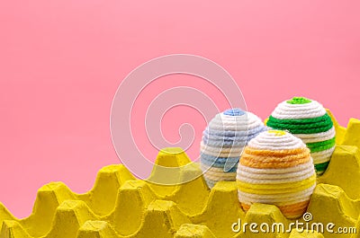 Colorful eggs decorate with knitting wool for Easter day Stock Photo