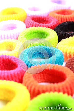 Colorful elastic hair bands vertical frame. Stock Photo