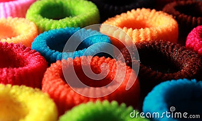 Colorful elastic hair bands with side lighting horizontal frame. Stock Photo