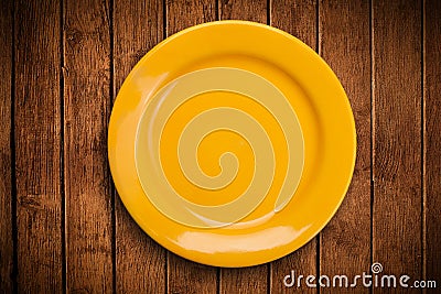 Colorful empty plate on grungy background table Stock Photo