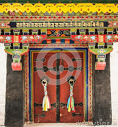 Colorful entrance door to Norbulinka monastery, Dalailama`s summer residence Stock Photo