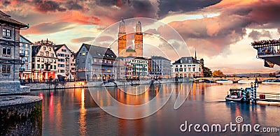 Colorful evening view of Grossmunster Church. Great autumn cityscape of Zurich, Switzerland, Europe. Stock Photo