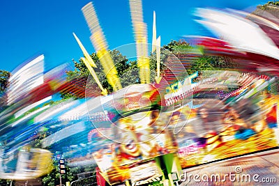 Colorful Extreme Fairground Ride. Spinning Motion Blur Fun Fair Stock Photo