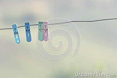 Colorful fabric clamps on wire Background blurry Stock Photo