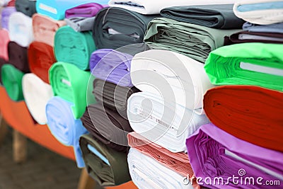 Colorful fabric rolls on textile market Stock Photo