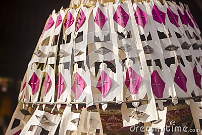 Colorful and festive Penjor Pole decoration. Detail of traditional dyed coconut leaves in Ubud Palace, Bali, Indonesia Stock Photo