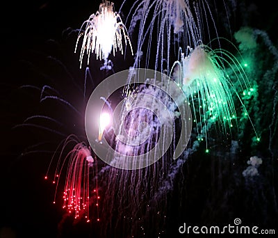 fiery sparks from huge fireworks during night celebrations Stock Photo