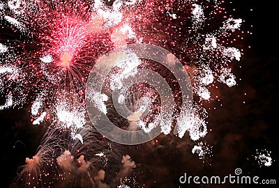 fiery sparks from huge fireworks during night celebrations Stock Photo