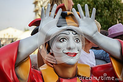 Colorful figure of a clown with arms raised Editorial Stock Photo