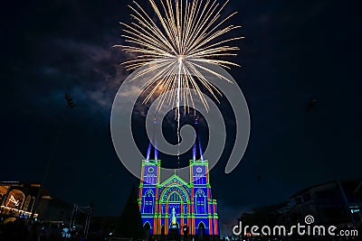 Colorful firework with virgin mary in the Christmas night Editorial Stock Photo