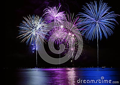 Colorful Fireworks over Lake Stock Photo