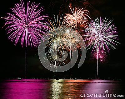 Colorful Fireworks over Lake Stock Photo