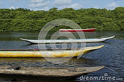 Colorful fishing canoes docked in the Jaguaripe river Stock Photo